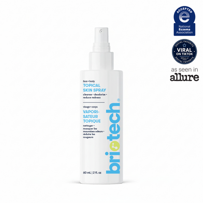 A white spray bottle of Topical Skin Spray featuring blue and yellow text, formulated to soothe irritation and visibly reduce blemishes. At the top right, three badges highlight its recognition: National Eczema Association, TikTok viral favorite, and as seen in Allure.
