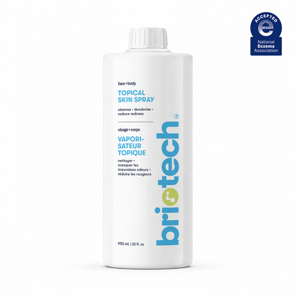 A white 32 fl oz bottle of Topical Skin Spray with blue and grey text and a National Eczema Association Accepted seal in the top right corner. This soothing spray helps calm irritation and reduce blemishes.