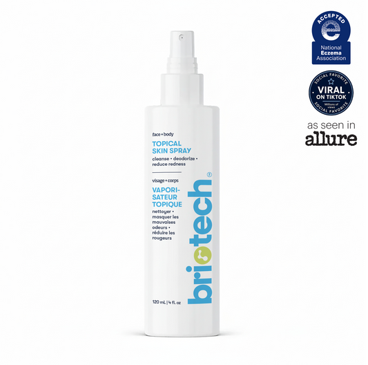 A white spray bottle labeled “Topical Skin Spray” features blue and yellow text. On the right side, award badges from the National Eczema Association, social media icons, and the Allure magazine logo are displayed. This soothing skin spray is formulated to calm irritation and promote healthier-looking skin.