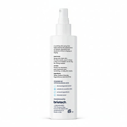 A white spray bottle of Topical Skin Spray, displaying the back label with product information, directions, ingredients, and company contact details in black and blue text. This spray calms irritation and reduces blemishes.