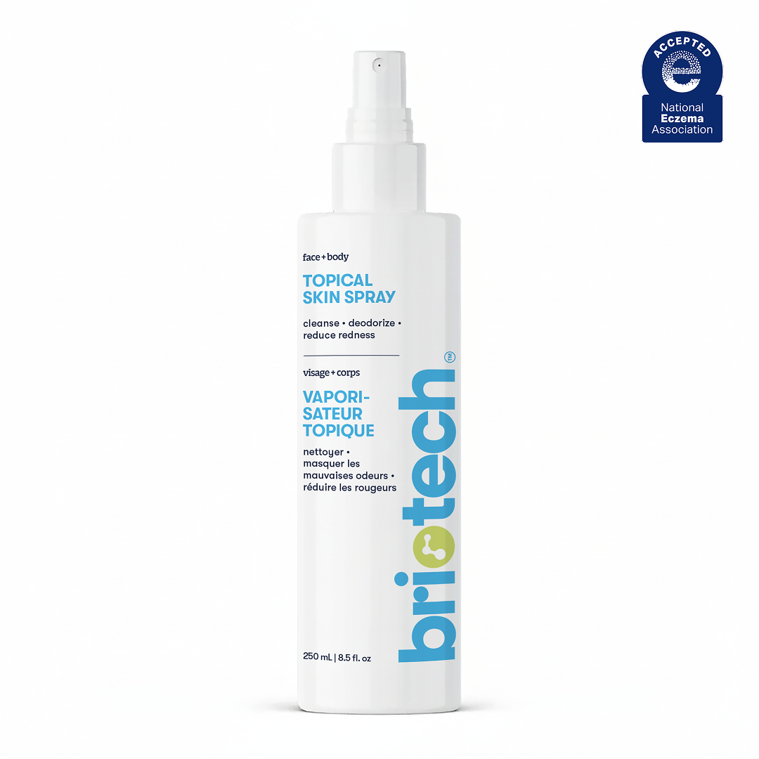 A white 250ml spray bottle labeled Topical Skin Spray for face and body is shown, featuring blue and yellow text plus a National Eczema Association logo in the top right corner. Suitable for soothing skin.