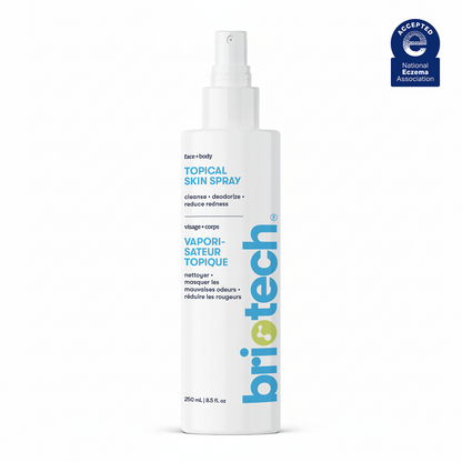 A white 250ml spray bottle labeled Topical Skin Spray for face and body is shown, featuring blue and yellow text plus a National Eczema Association logo in the top right corner. Suitable for soothing skin.